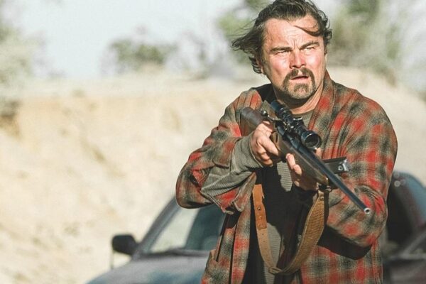 Leonardo di Caprio with rifle