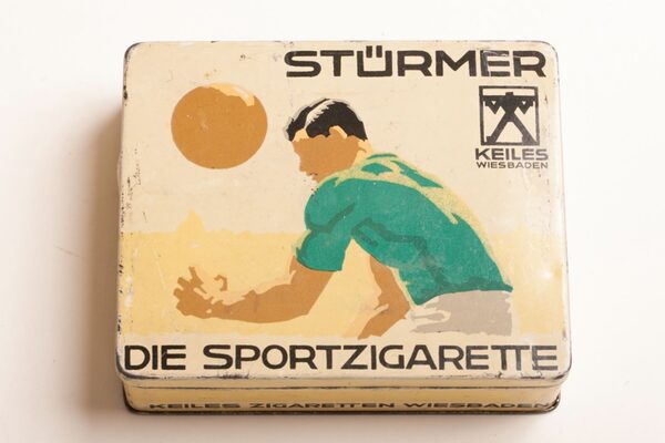Can of striker sports cigarette with man playing ball