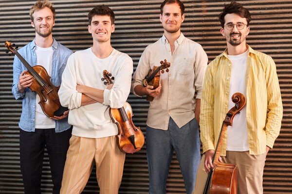 Four men with string instruments