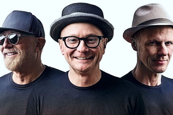 Three men with hats