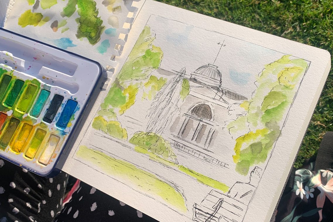 Gebäudegrfik mit Aquarellfarbkasten, Rasen im Hintergrund