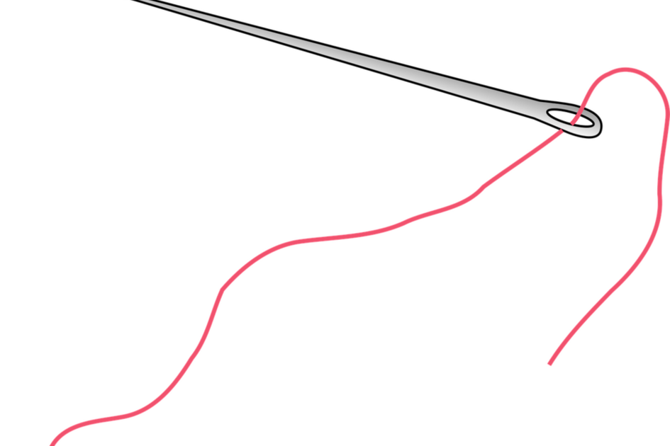 Nadel mit rotem Faden im Nadelöhr