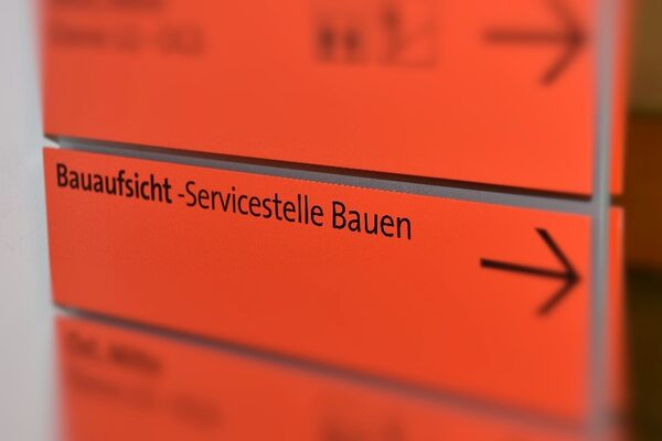 Address sign in orange of the building inspectorate - Building Service Center