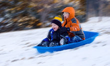Children enjoying the snowy weather.