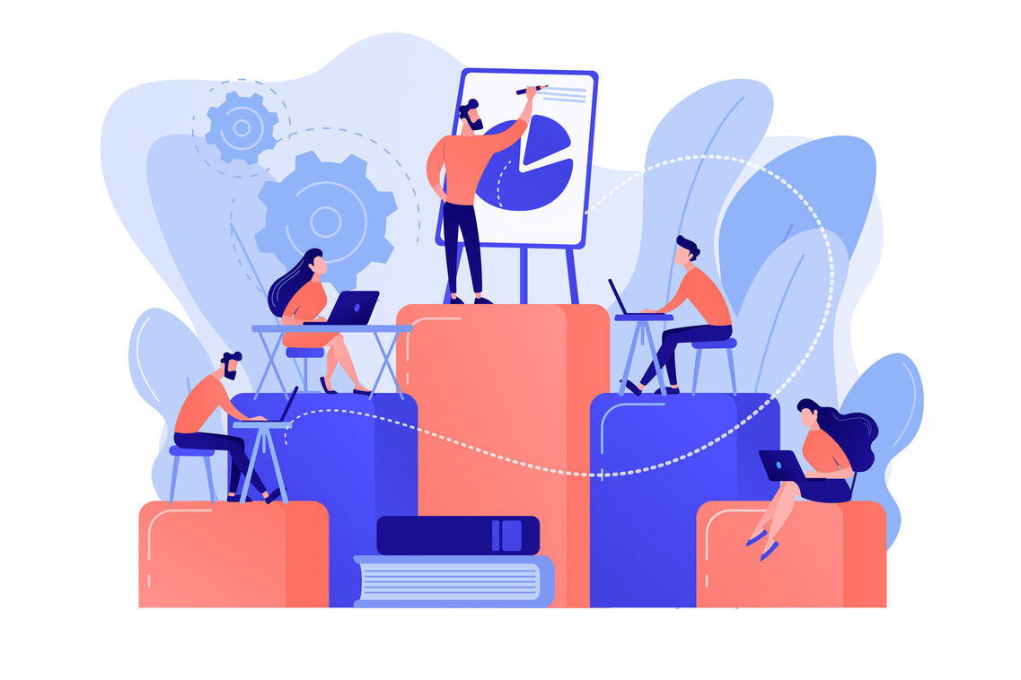 Vier Personen arbeiten am Laptop, eine Person zeigt auf ein Kreisdiagramm