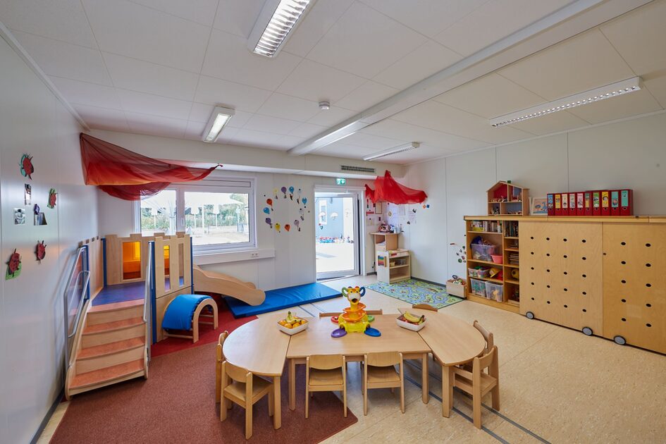 Playroom with slide area and table