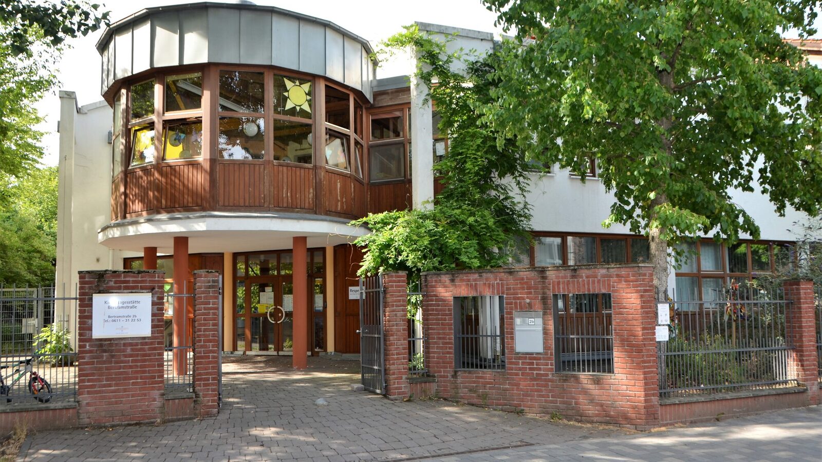 The courtyard gate with the daycare center building