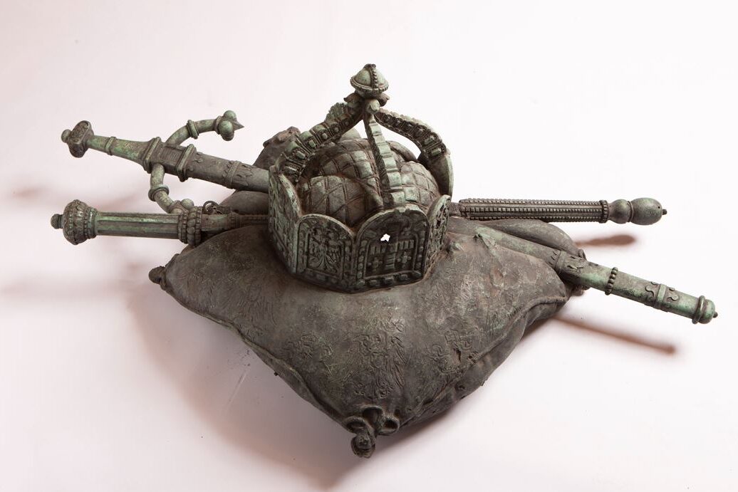Bronze crown, sceptre and sword on a bronze cushion