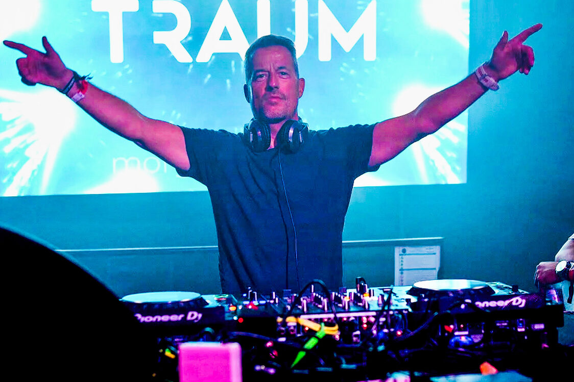 Man at a DJ mixer.