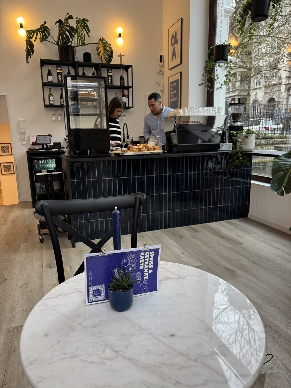 Café with table and chairs in front
