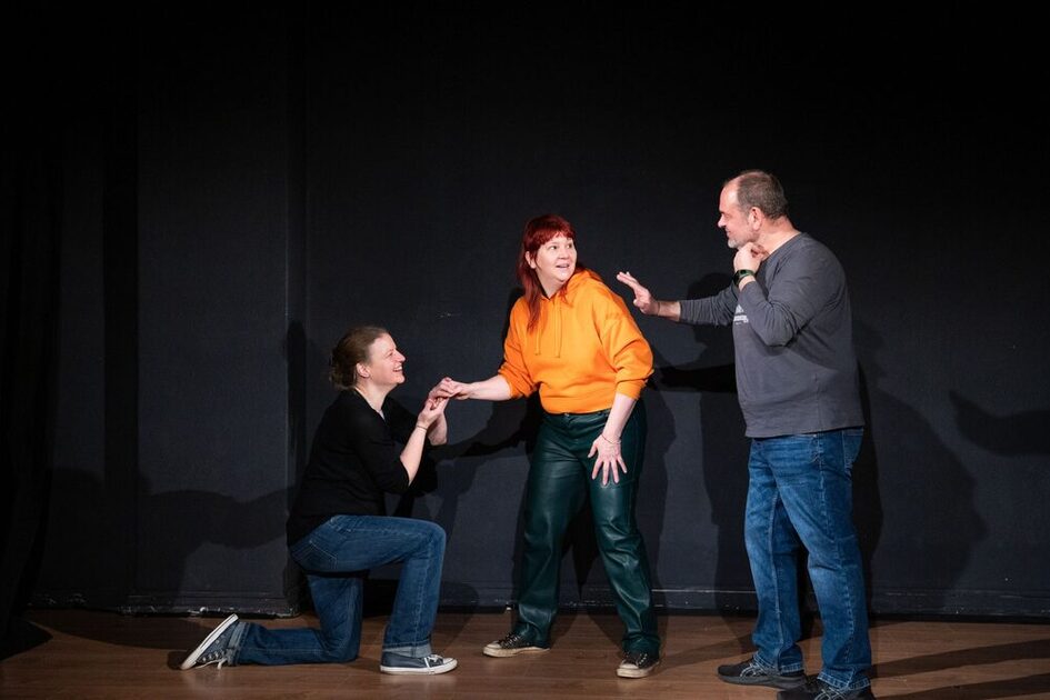 Three people playing on stage