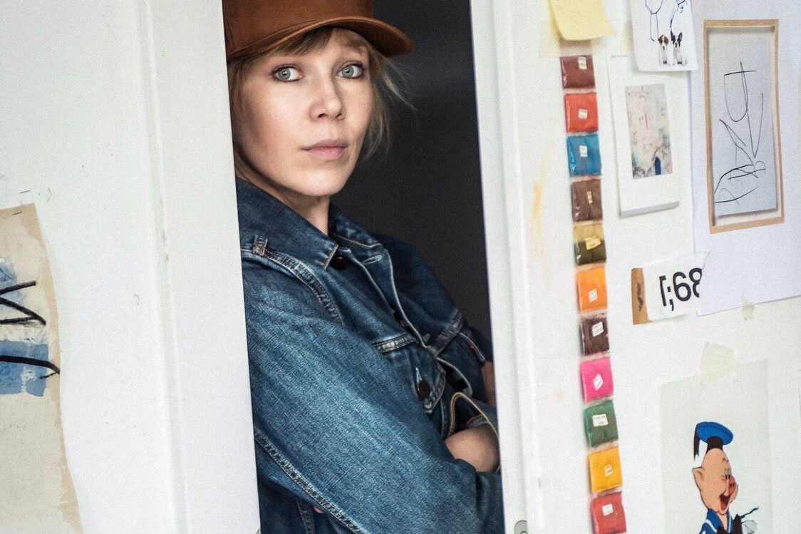 Artist Jenny Brosinski standing in a doorway