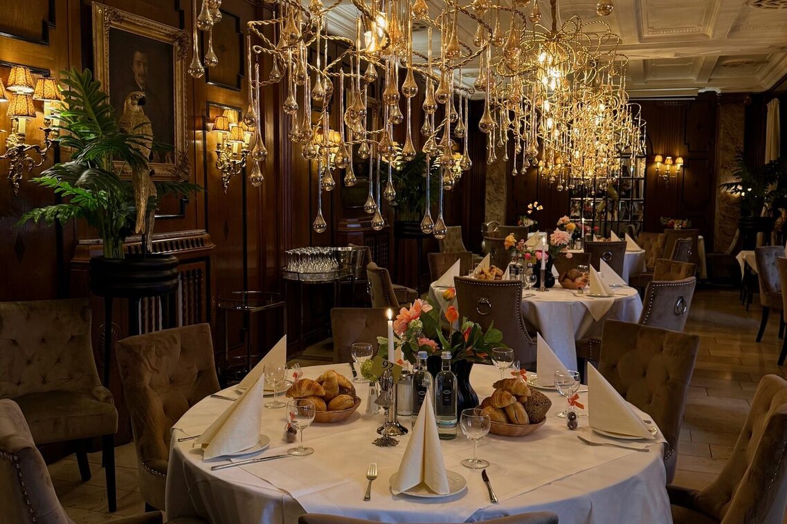 View of a festive room with chandeliers