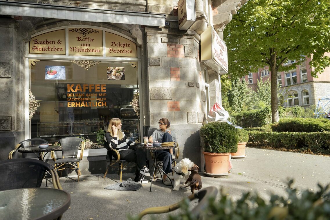 Two women in front of a café