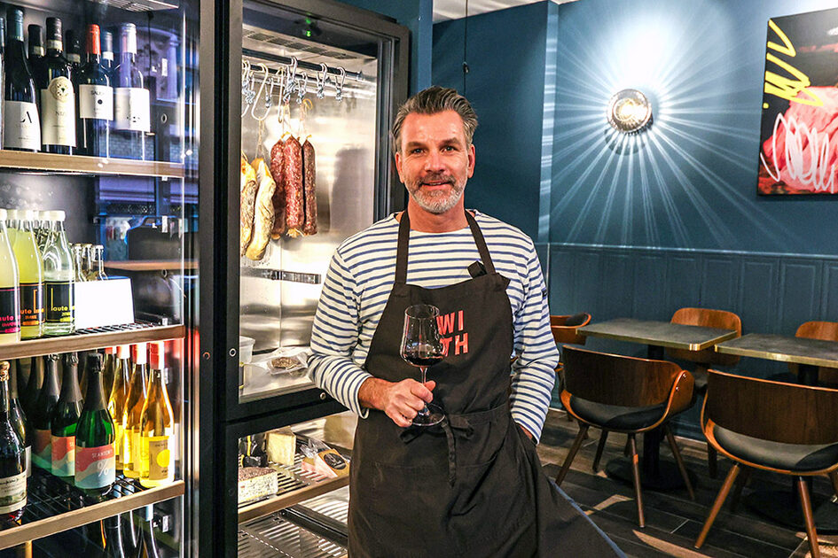 Kai Kenngott with wine glass in hand