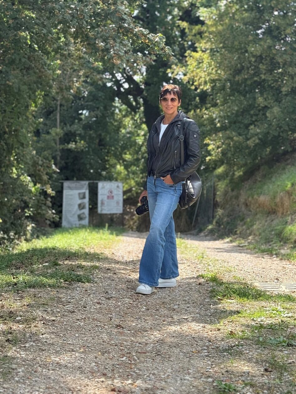 Woman in the forest with camera