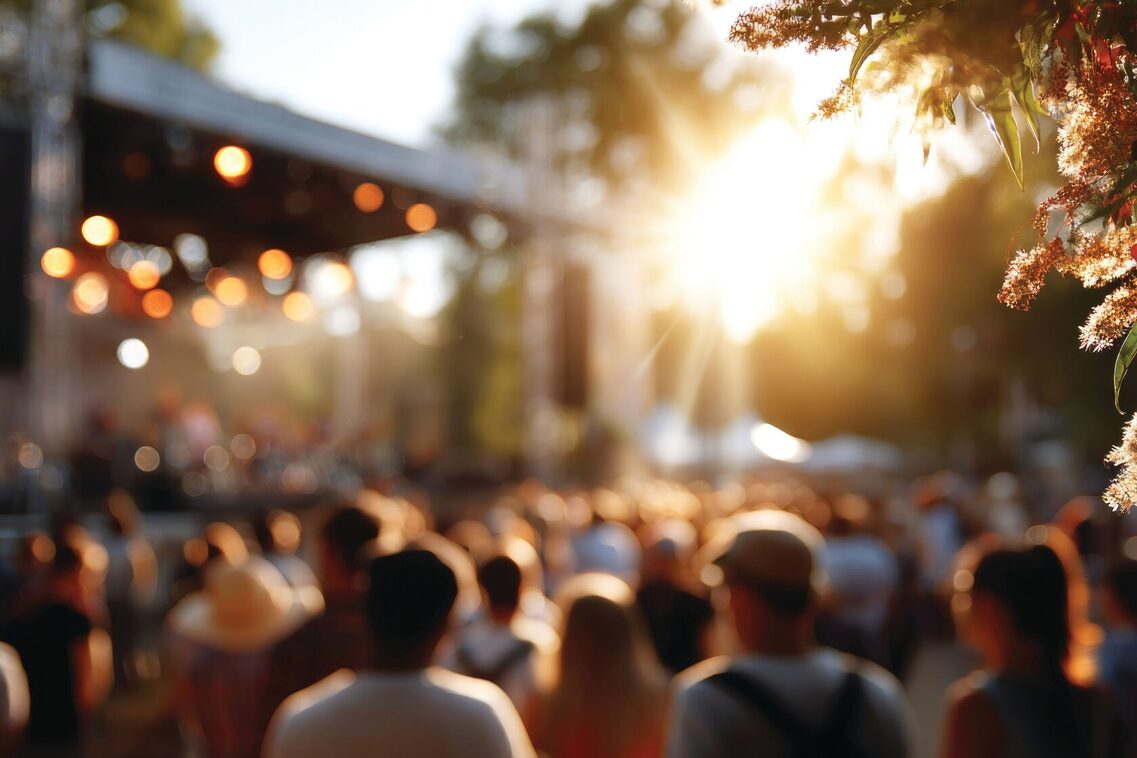 People at summer music festival outdoors, blurred background