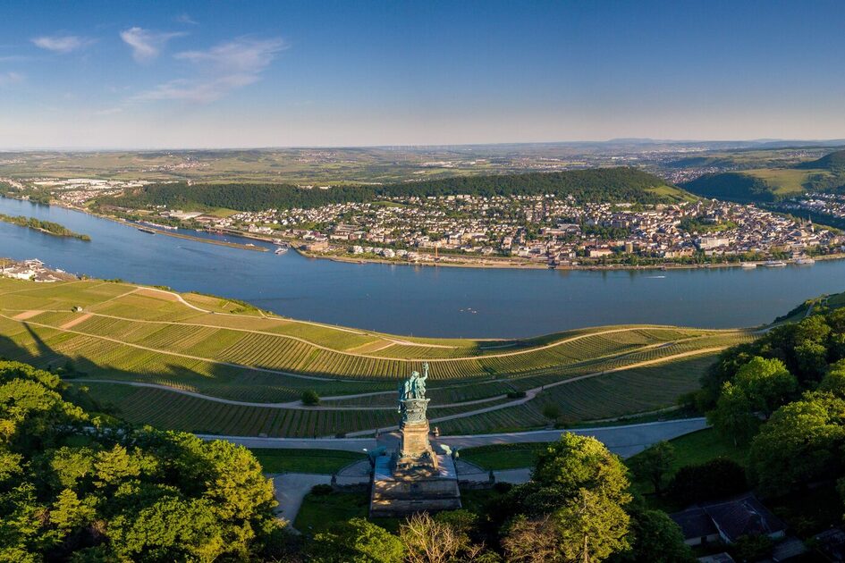 Aerial view with drone from Niederwalddenkmal View of Bingen am Rhein during sunset on a partly cloudy day in summer, Rheingau Hesse