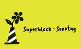 Logo des Superblock-Sonntags - ein Pylone in dem eine Blume steckt