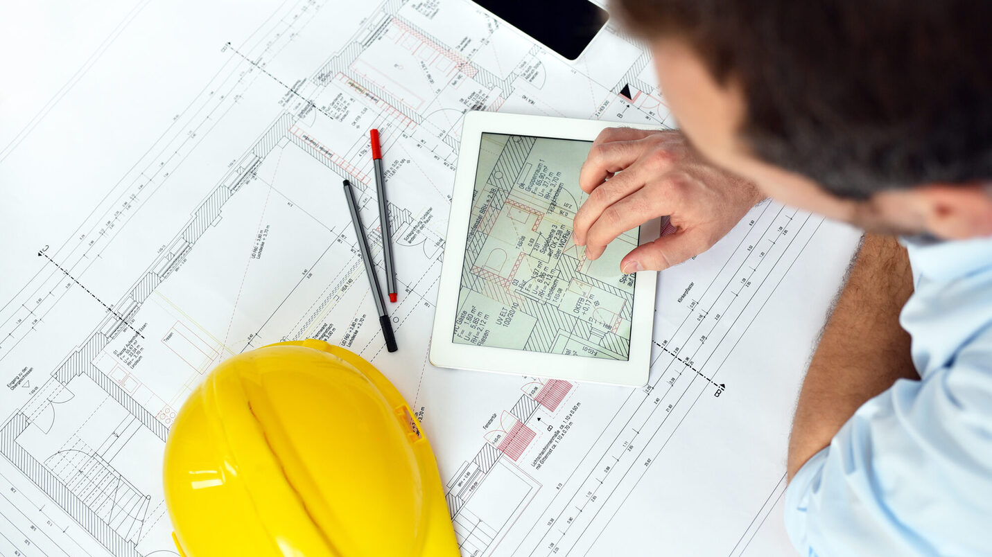 ArchitectPlanning Construction of a house on the Boaerd with the technical drawing - floor plan