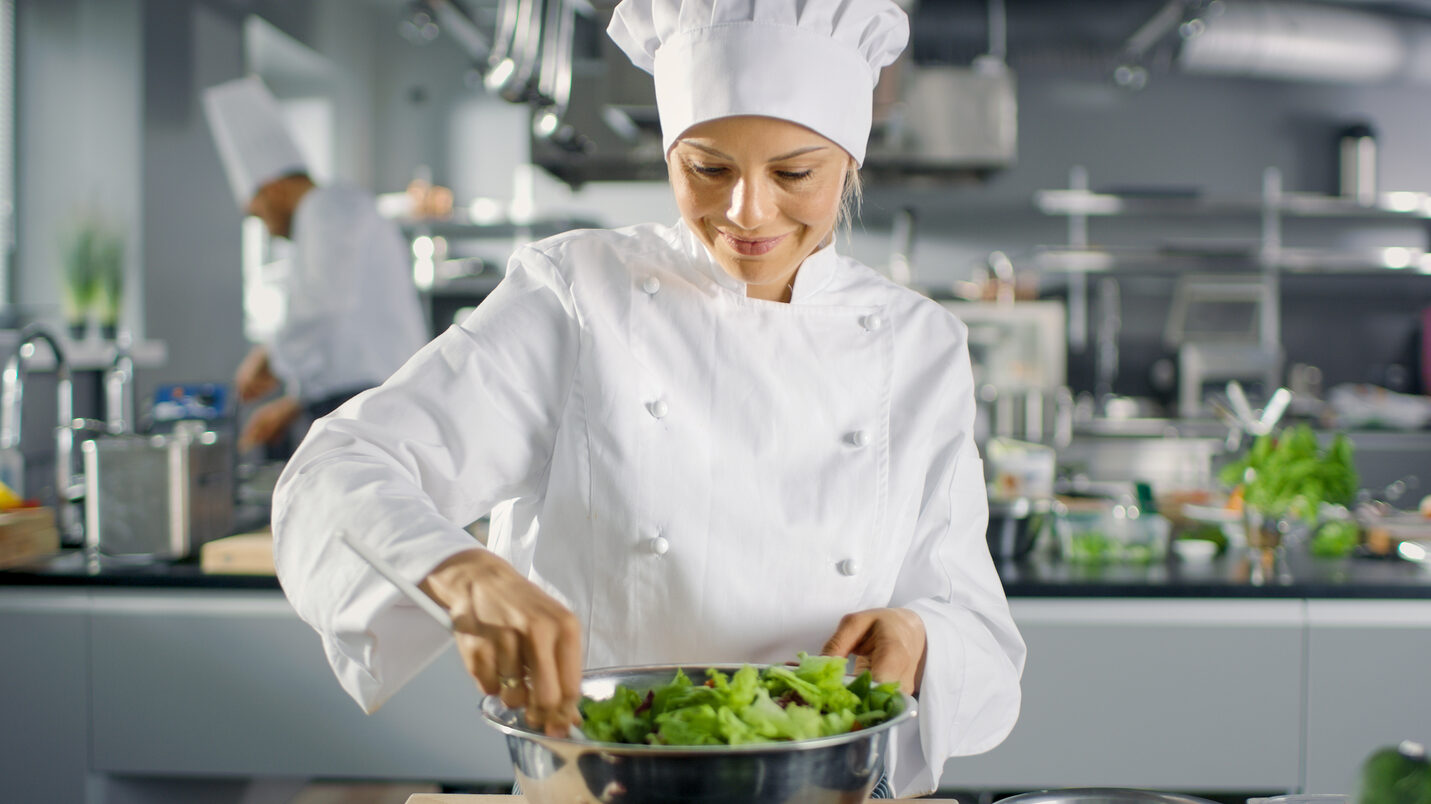 In,A,Famous,Restaurant,Female,Cook,Prepares,Salad.,She,Works