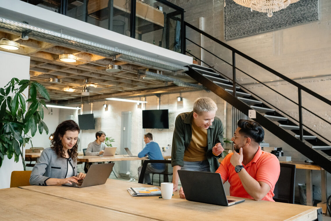 Diverse Team Collaborating in Modern Open Space Office