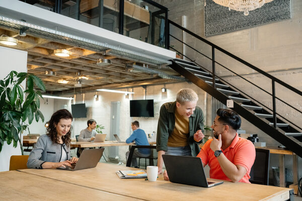 Diverse Team Collaborating in Modern Open Space Office